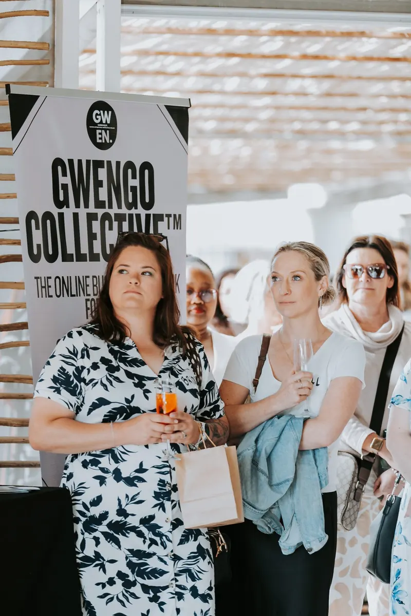 Members at the GwenGo Collective banner