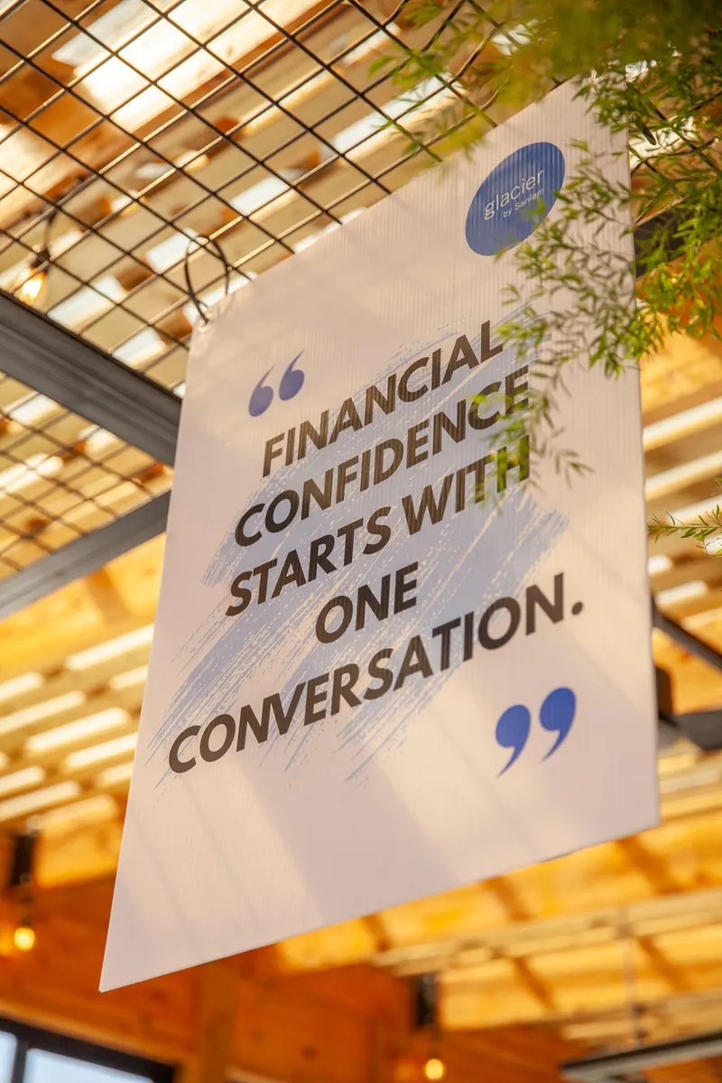 A sign at the event: Financial confidence starts with one conversation