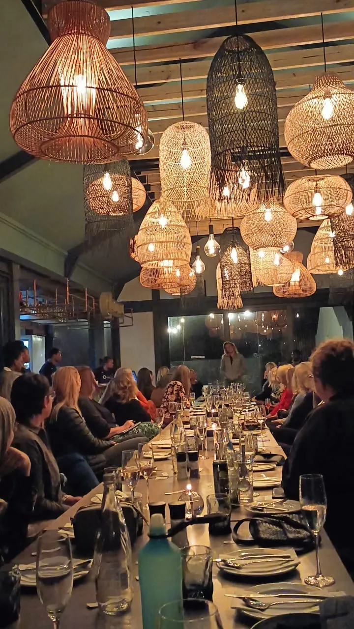 Long tables under woven lights, Upstairs at Sirocco