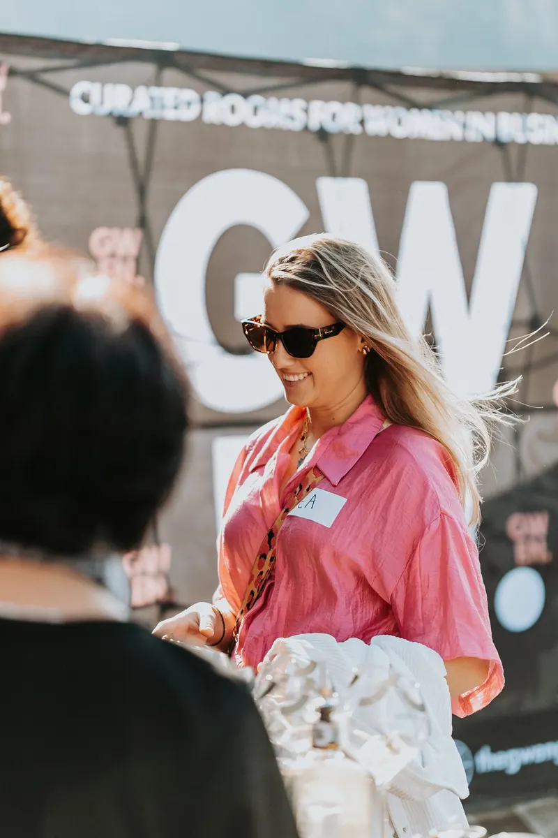 A member arriving in a pink shirt, June 2026