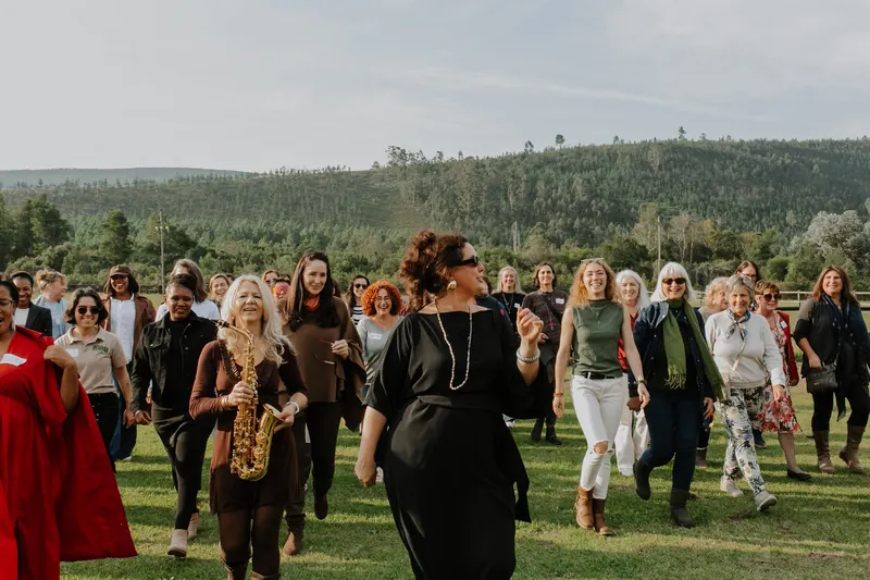 Members walking across the lawn at Kay & Monty