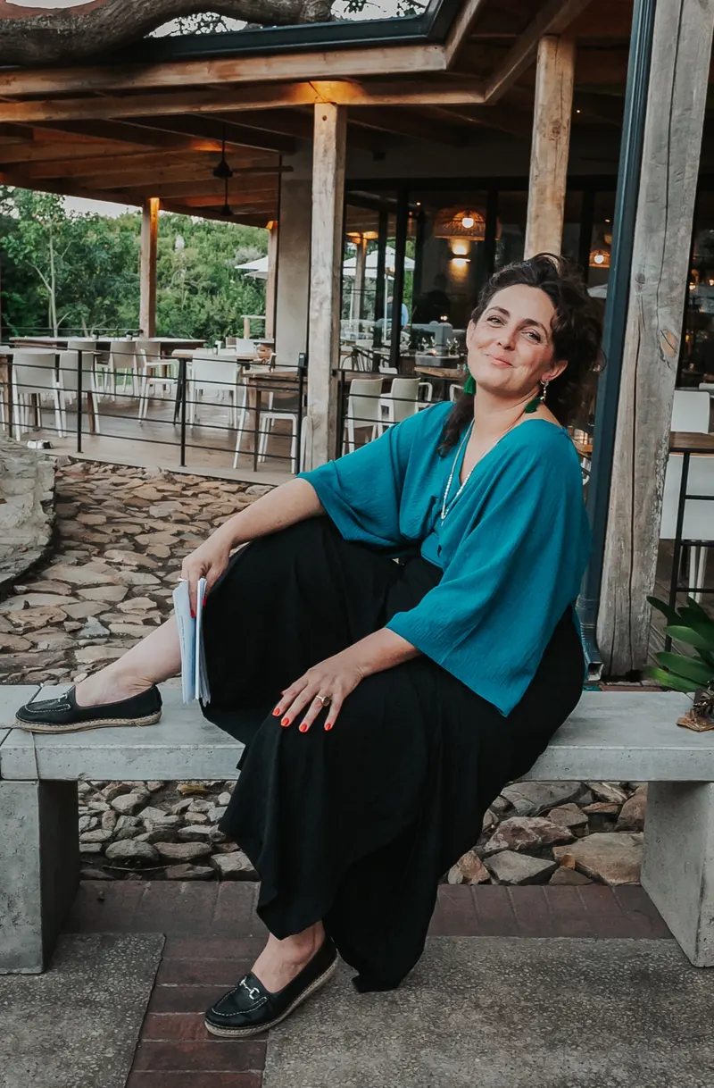 A guest on a bench in the courtyard, May 2025