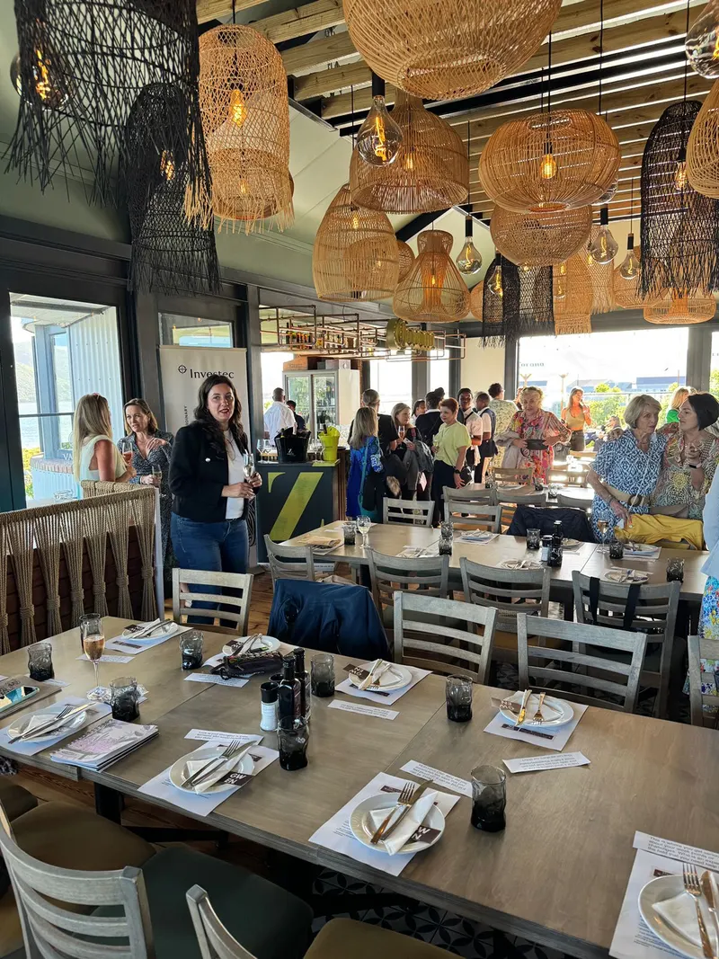 Tables set for dinner as guests arrive, Upstairs at Sirocco