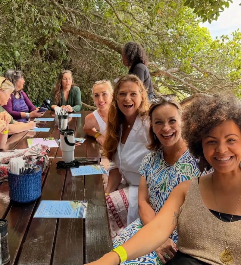 Members at a long lunch table at a Members’ Day Out